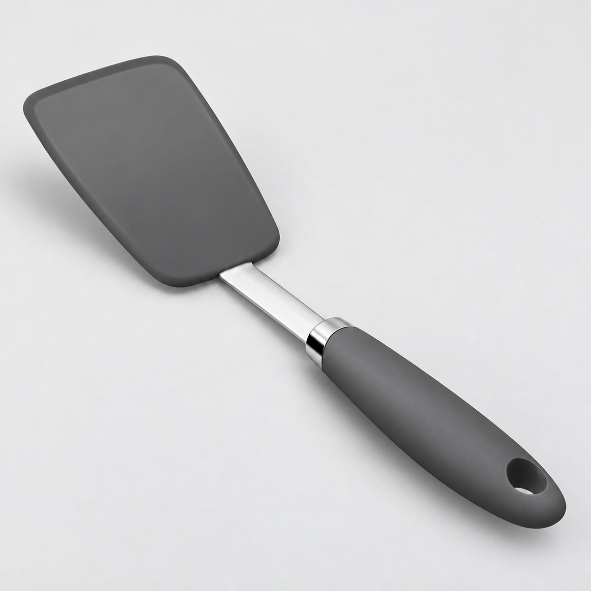 One complete charcoal silicone turner spatula with hanging-hole handle.