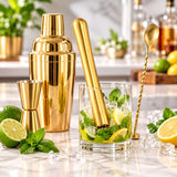 Cocktail muddler and bar spoon preparing fresh mint drink ingredients
