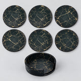 Six black and gold 10 cm coasters with one matching storage holder.
