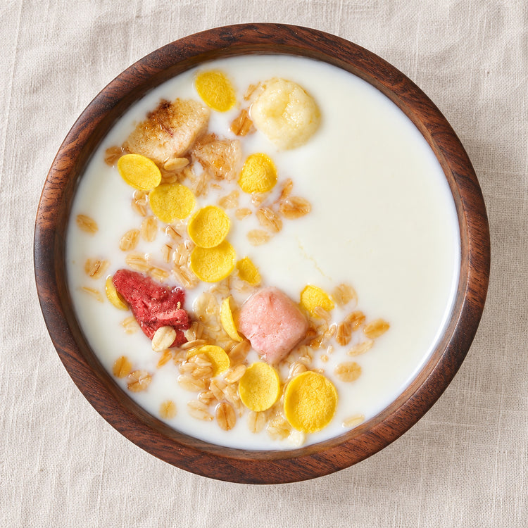Natural acacia bowl used for breakfast cereal with milk.