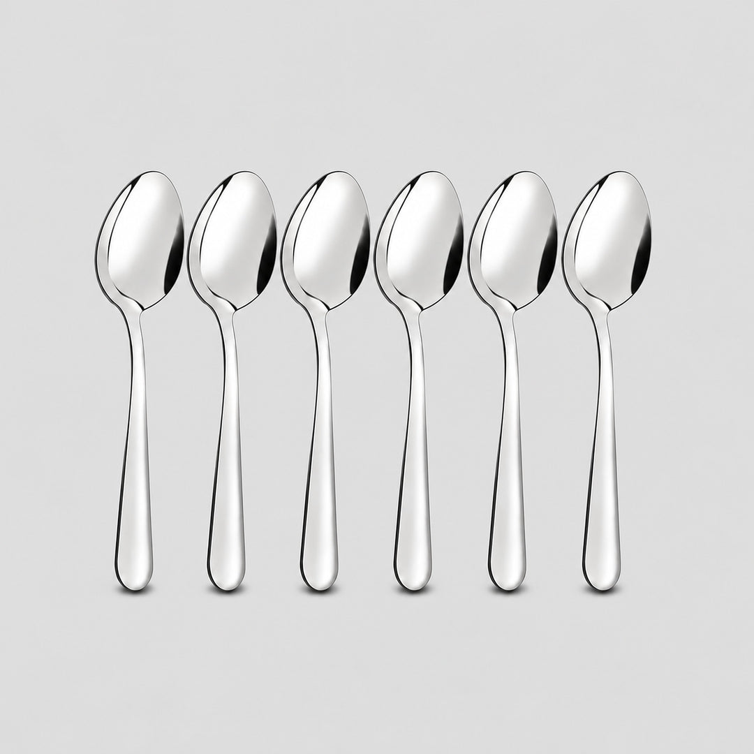Six-piece set of matching silver stainless steel teaspoons.