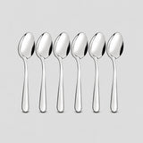 Six-piece set of matching silver stainless steel teaspoons.