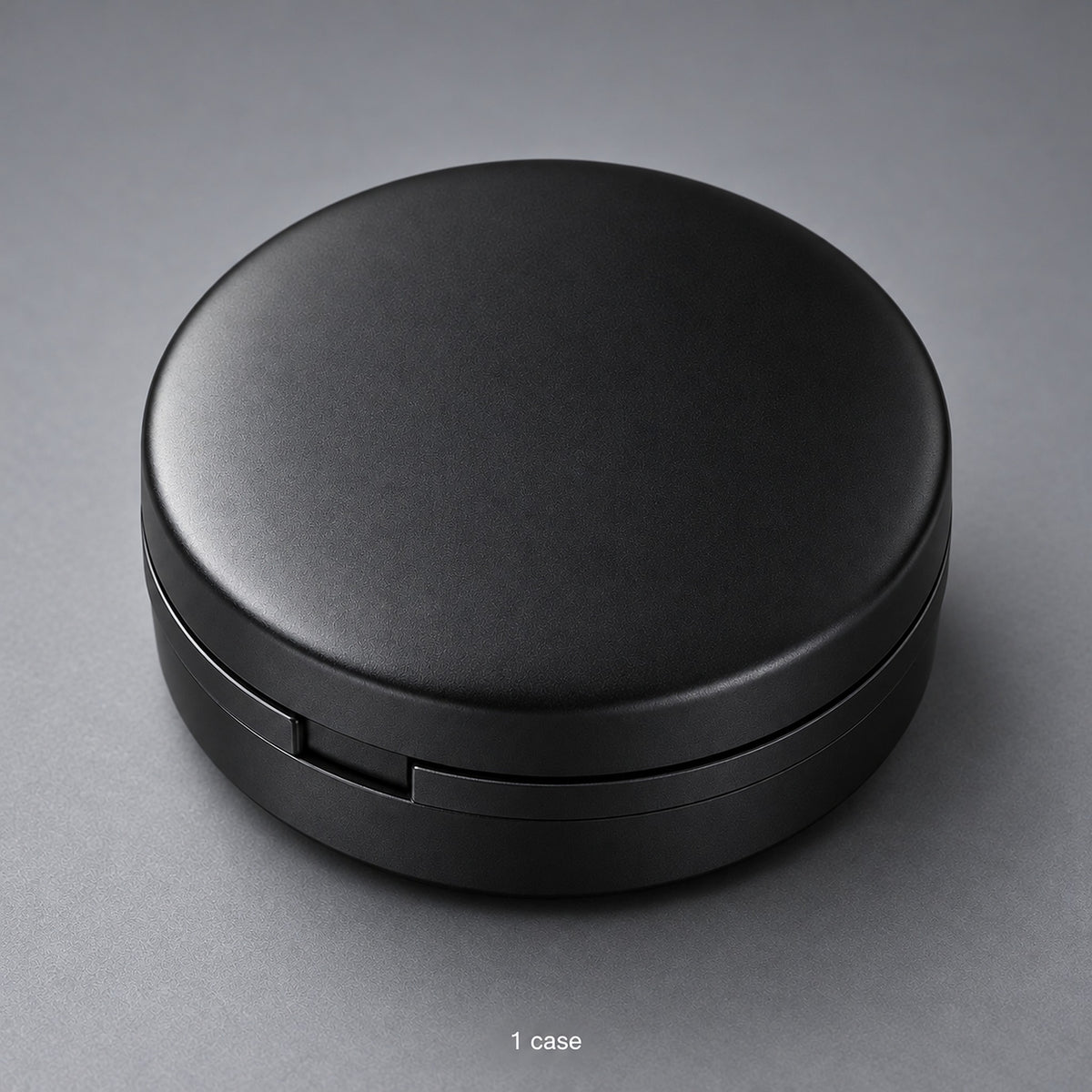 One closed black round storage case; case-only contents.
