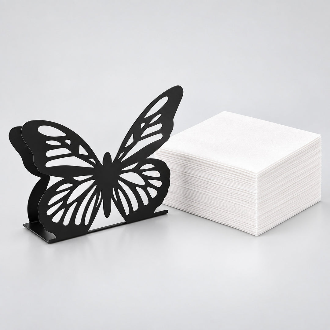 Decorative metal napkin holder with stack of white napkins included