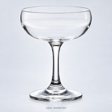 One empty coupe glass in the selected style.