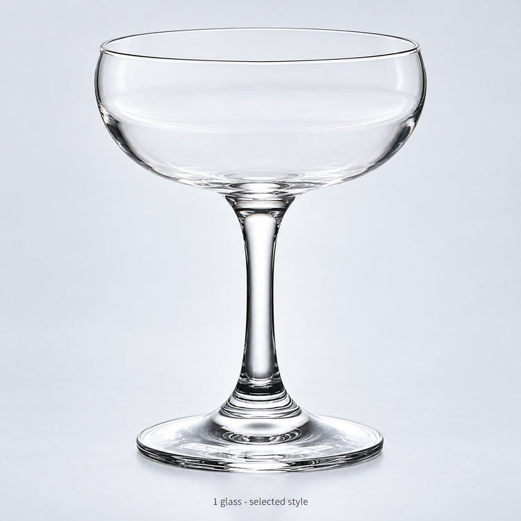 One empty coupe glass in the selected style.