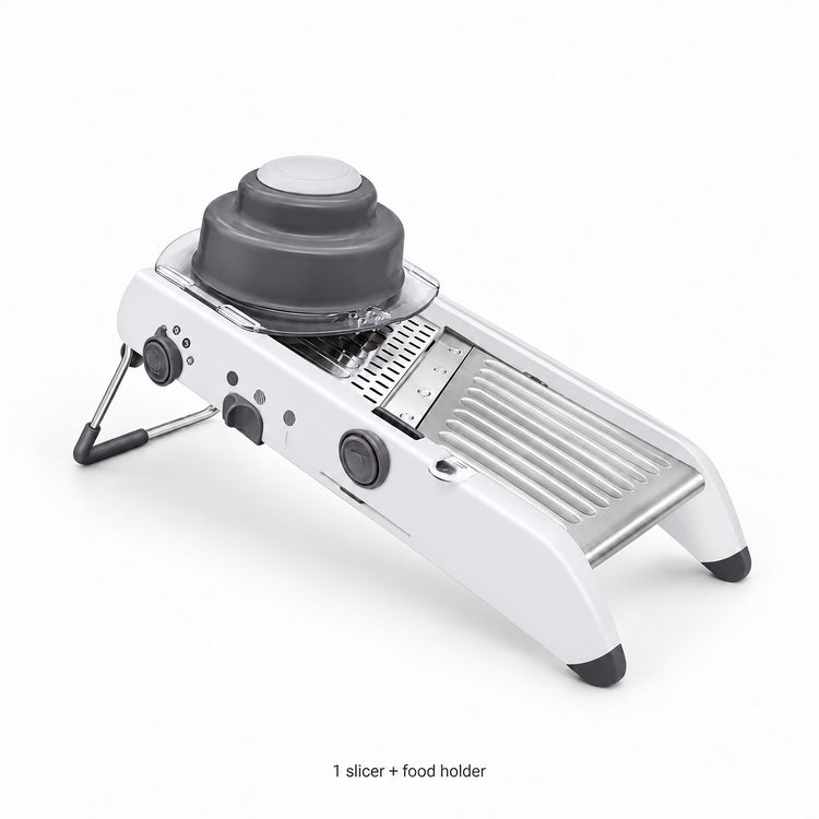 One complete white mandoline slicer with its gray food holder.