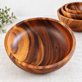 Large acacia wood serving bowl with visible interior wood grain
