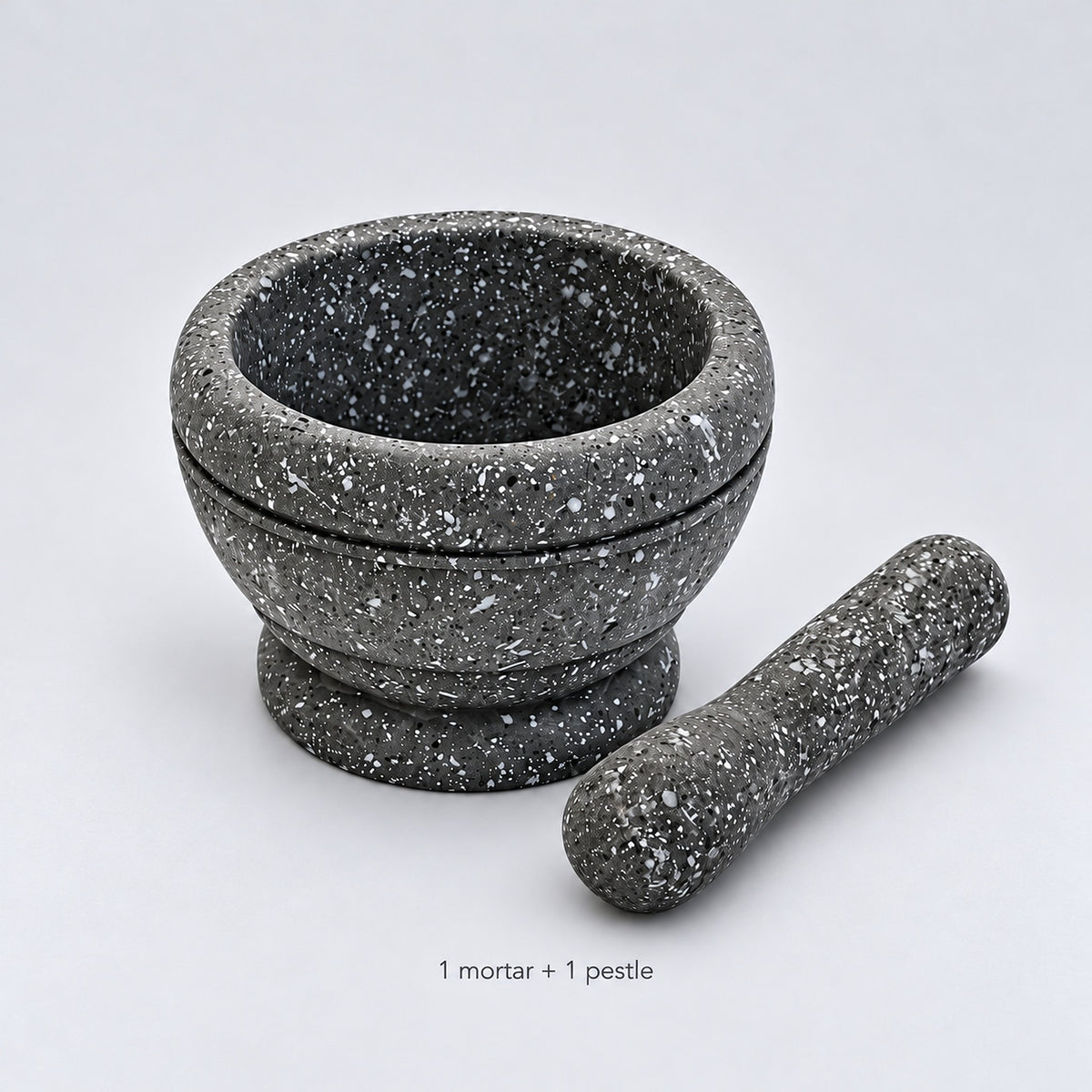 One gray speckled mortar and one matching pestle; no ingredients or accessories included.