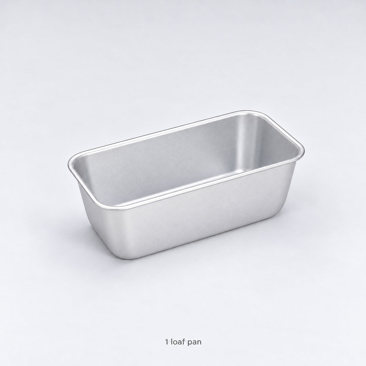 One empty anodized aluminum loaf pan included, without a lid.