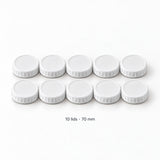 Ten white 70 mm lids; lids-only contents with no jars.