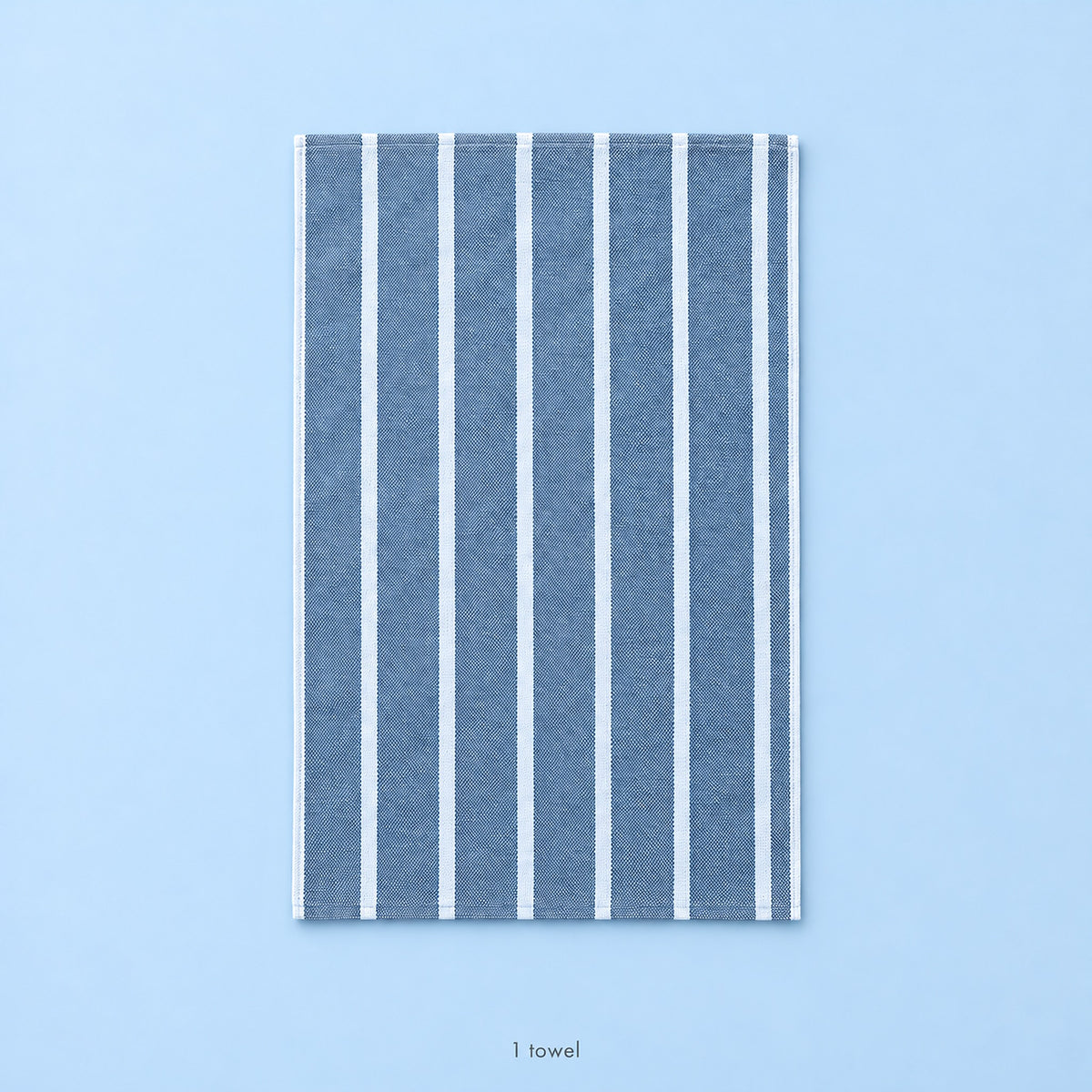 One unfolded blue-striped cotton towel; single-piece contents.