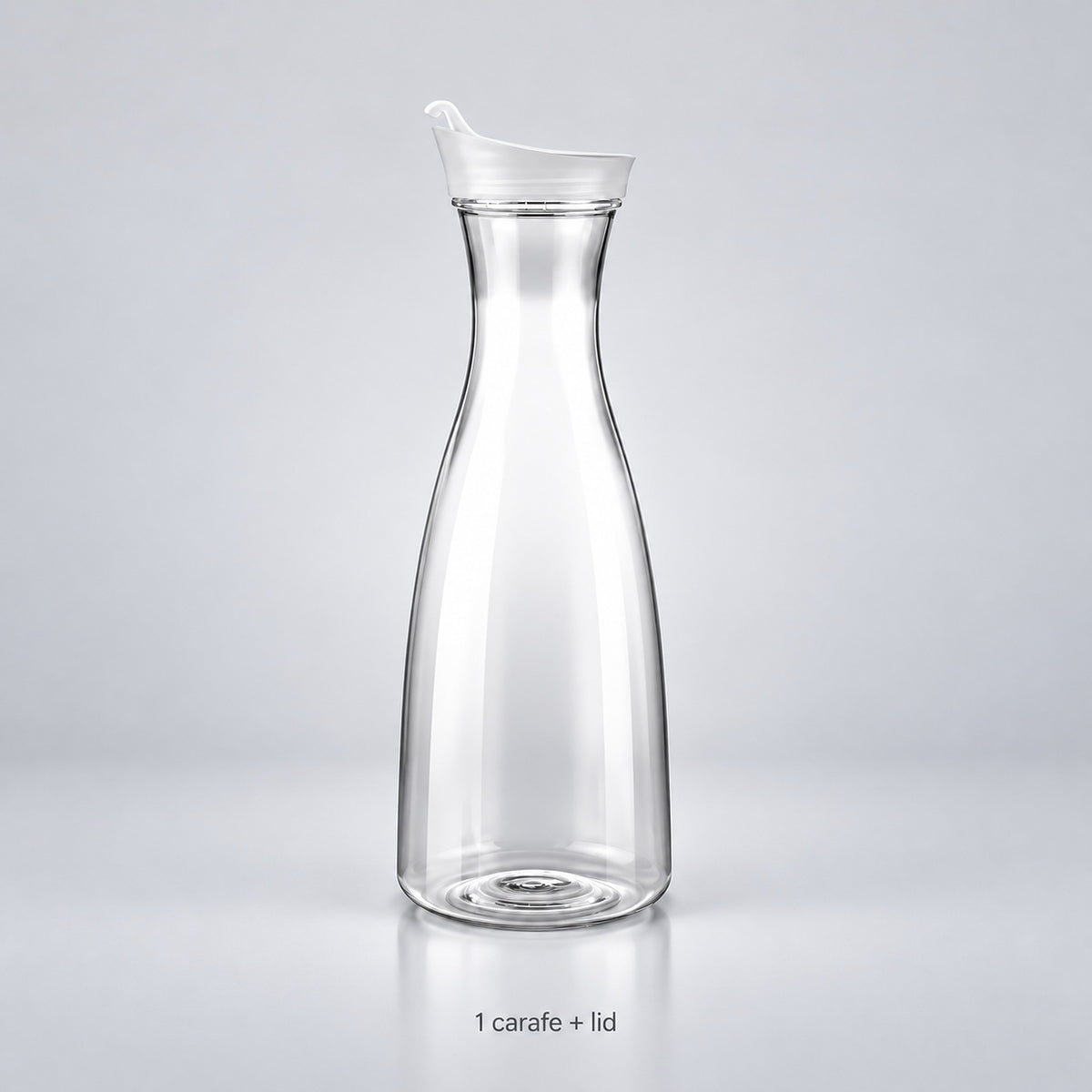 One empty clear plastic carafe with its fitted lid.