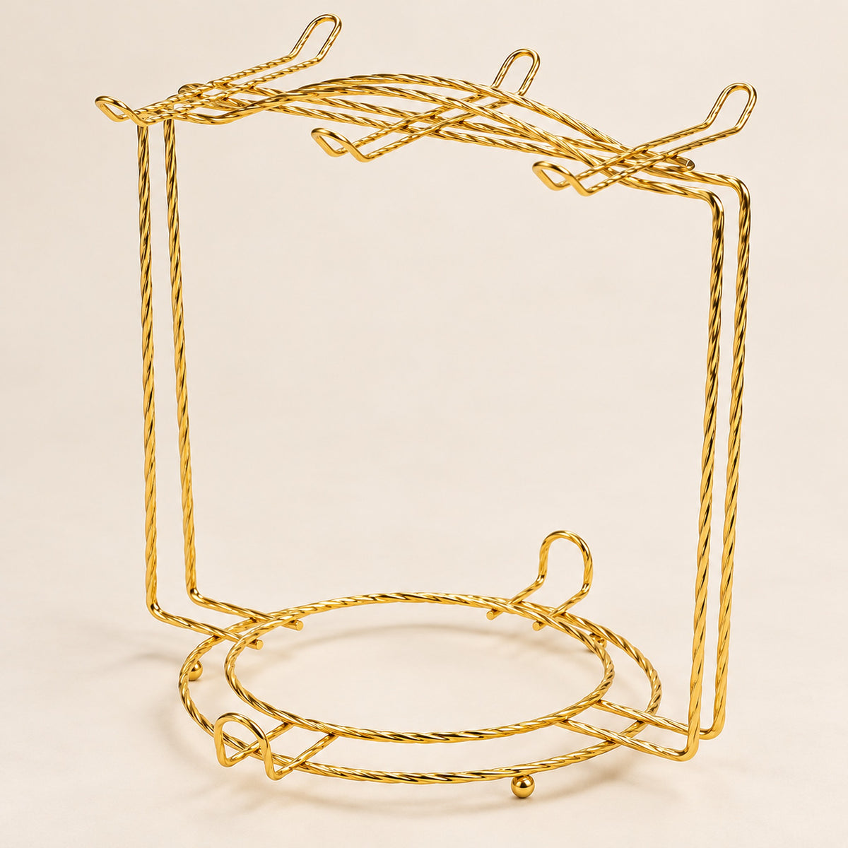 Gold twisted-wire rack showing curved cup hooks and circular saucer-support rings.