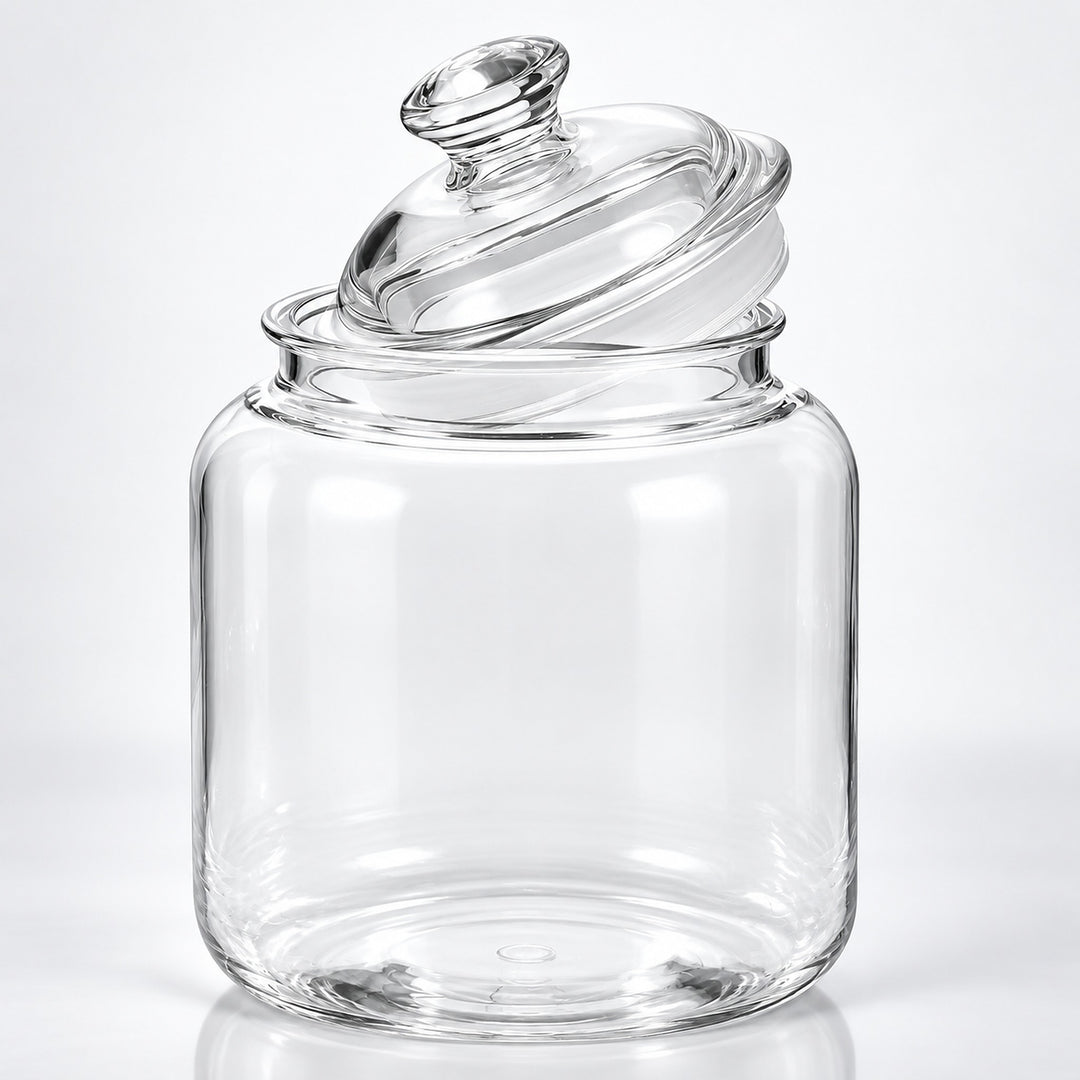 Clear glass jar with a matching glass lid, photographed on a clean white studio background.