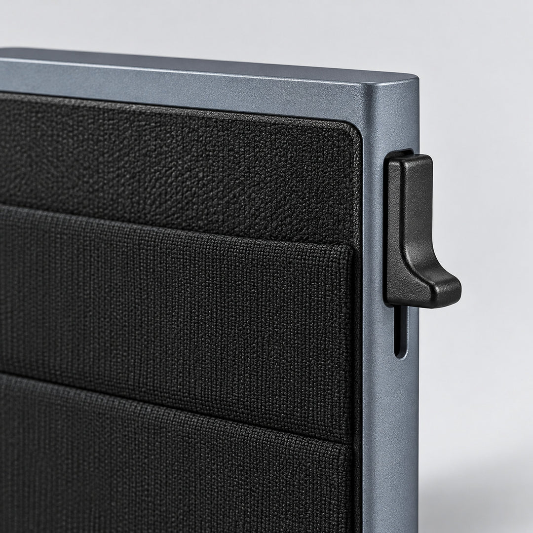 Close-up of the metal frame, textured front pocket and side lever.