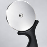 Close-up of the steel pizza wheel, center rivet and black handle guard.