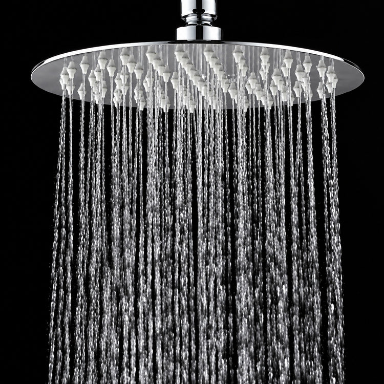 A round chrome rain shower head with water cascading down against a solid black background.