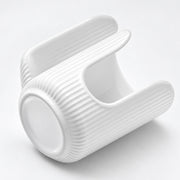 A white ribbed ceramic cup with a built-in lid, shown on a clean white background.