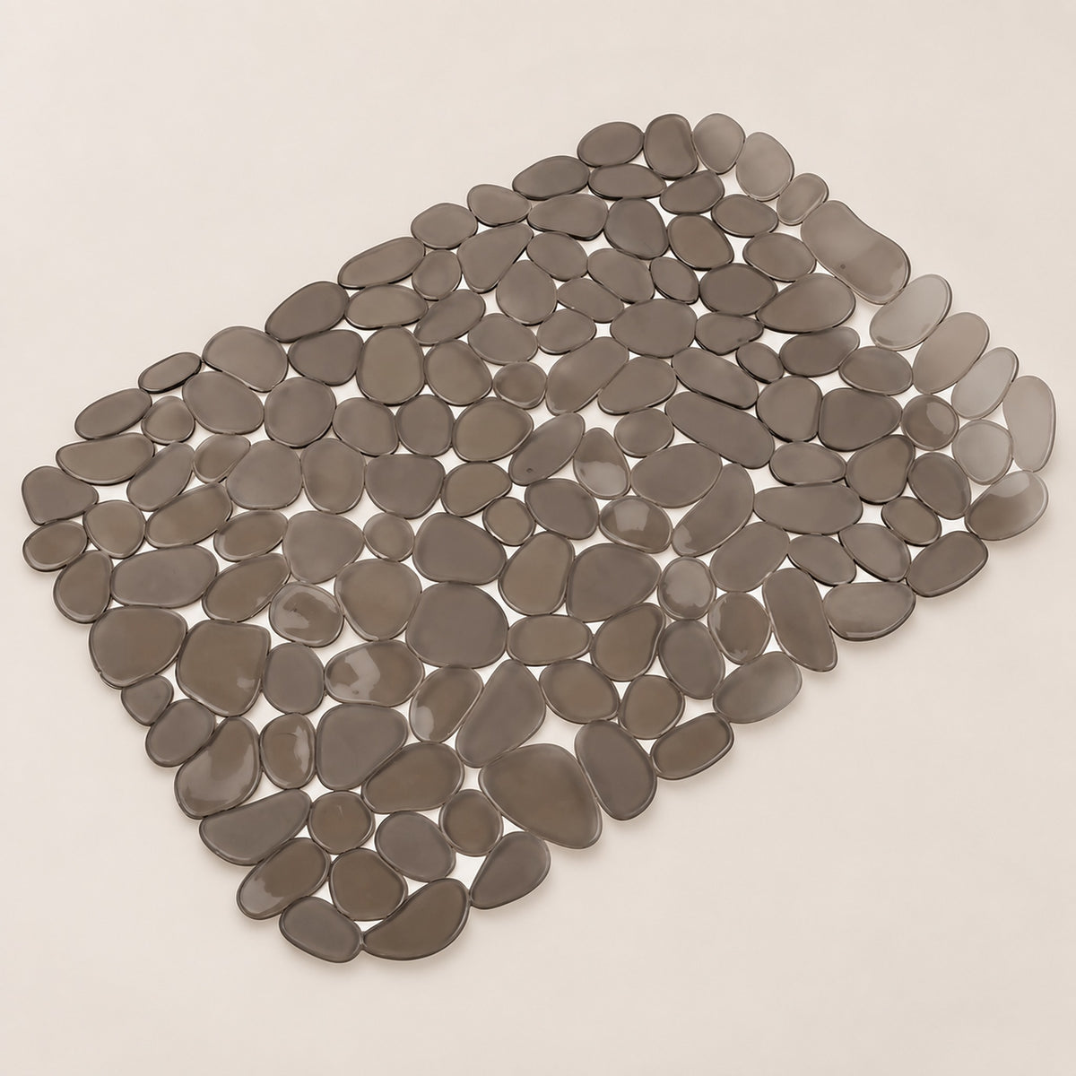 A rectangular arrangement of smooth, pebble-shaped gray tiles on a light beige background.