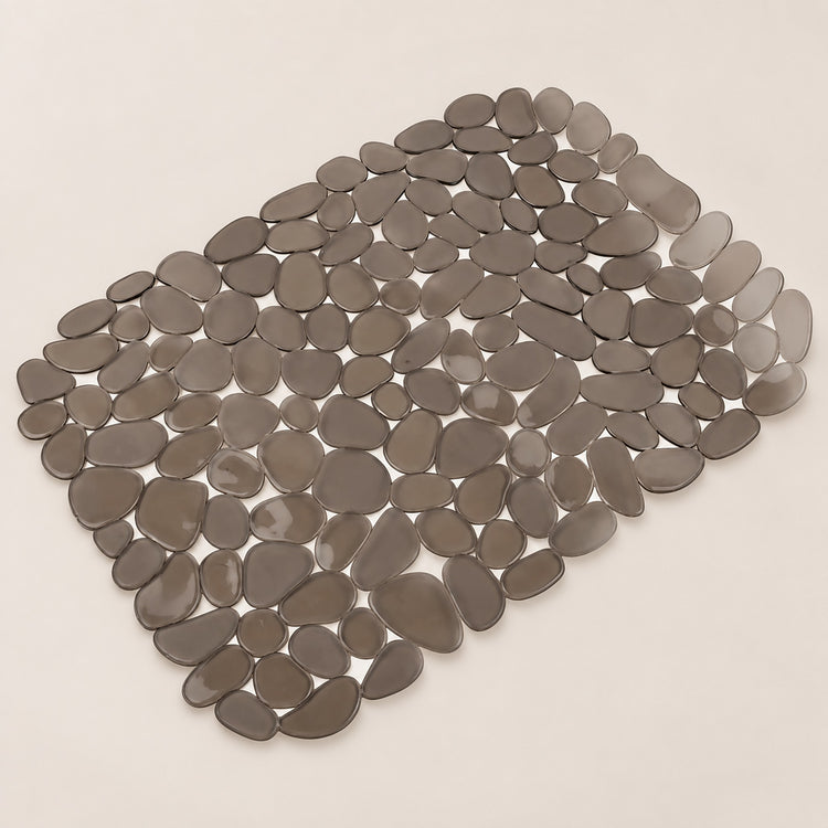 A rectangular arrangement of smooth, pebble-shaped gray tiles on a light beige background.