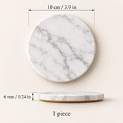 A round white marble coaster with gray veining, shown with dimension annotations indicating a diameter of 10 cm (3.9 in) and a thickness of 6 mm (0.