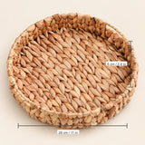 Round woven natural fiber tray with dimension labels showing 28 cm in diameter and 6 cm height, on a light beige background.