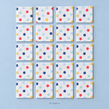 Twenty folded large-dot paper napkins, arranged four by five.