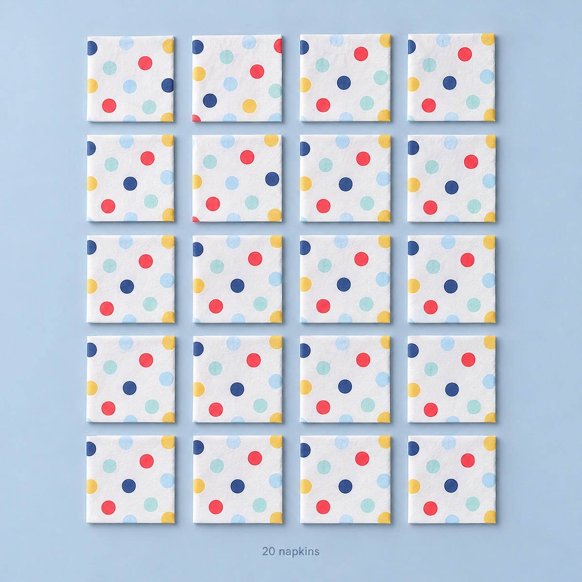 Twenty folded large-dot paper napkins, arranged four by five.