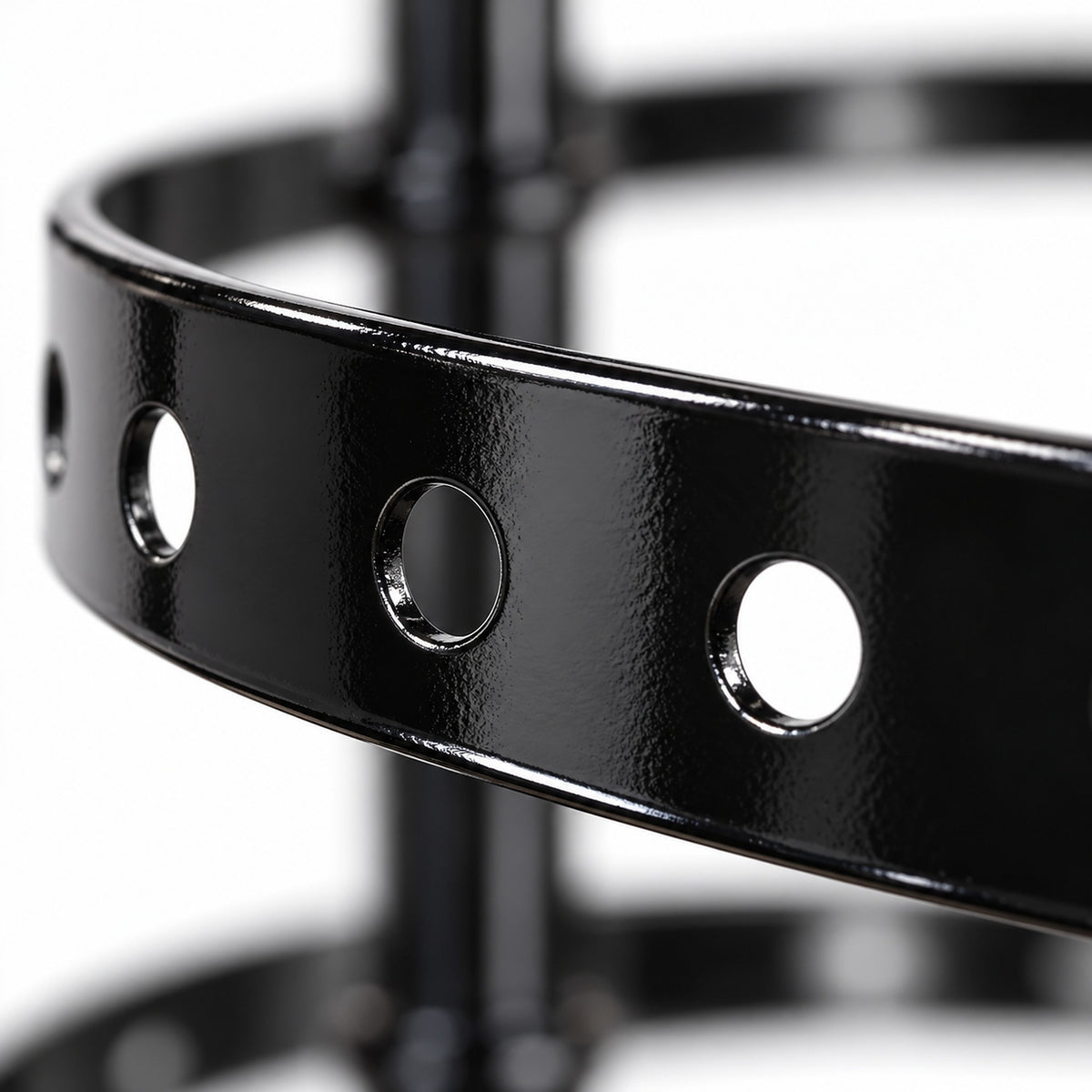 Black metal earring ring with round hanging holes.