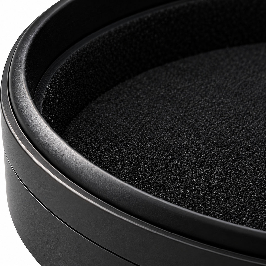 Macro of the round case aluminum rim and soft black lining.