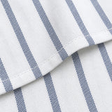 Macro of flat cotton weave, fine blue stripe and stitched hem.