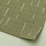 Close-up of olive-green vinyl weave and smooth trimmed corner.