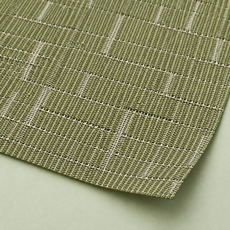 Close-up of olive-green vinyl weave and smooth trimmed corner.