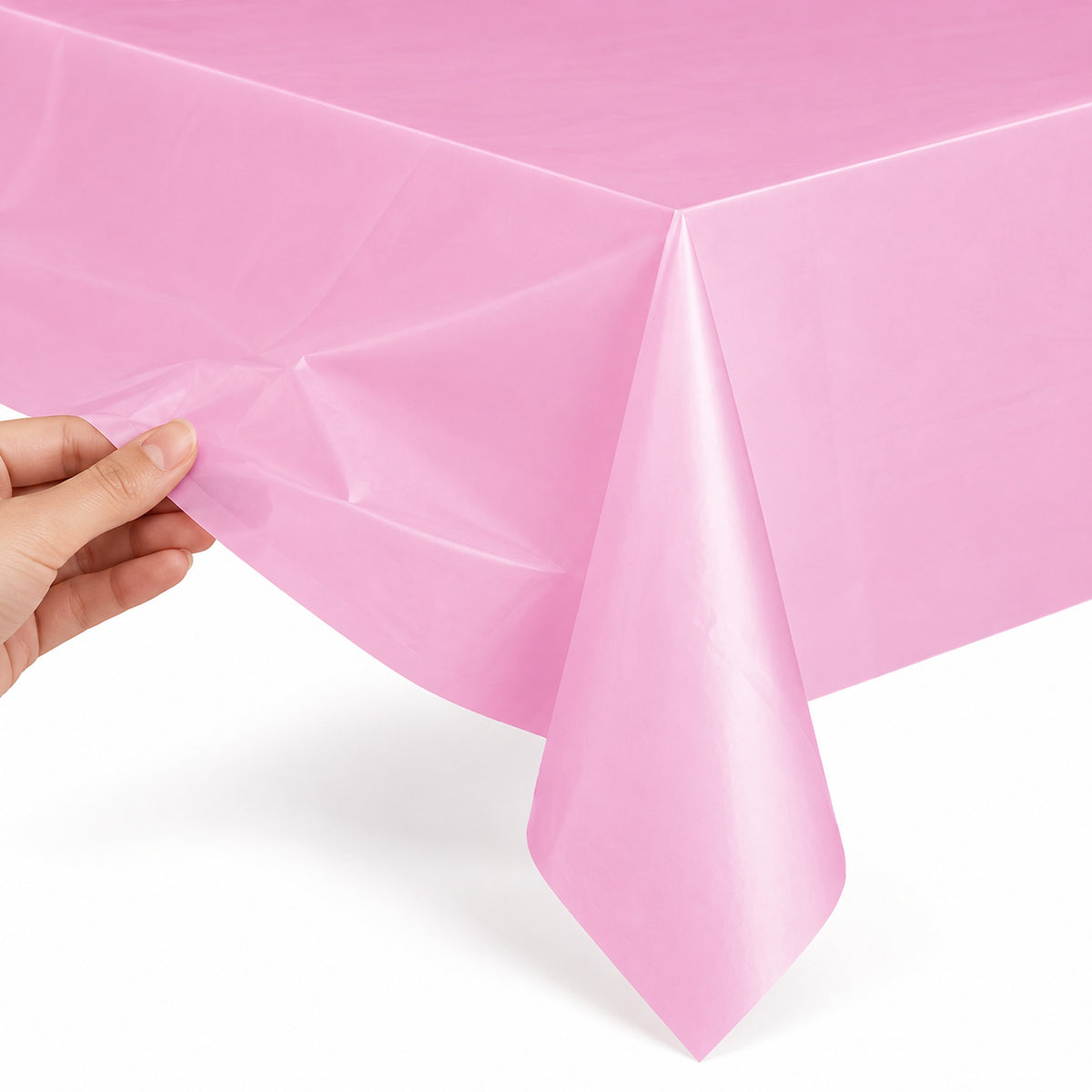Thin pink matte plastic table cover edge detail.