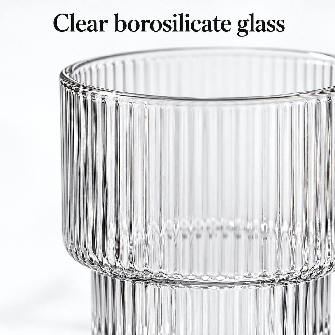 Close-up of clear borosilicate glass ribs, rim and stepped base.