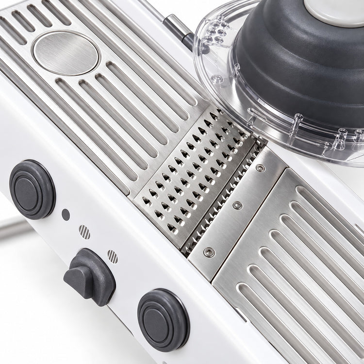 Stainless-steel slicing deck, blade and julienne section detail.