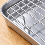Close-up of the rolled tray edge and slim wire rack at a rounded corner.