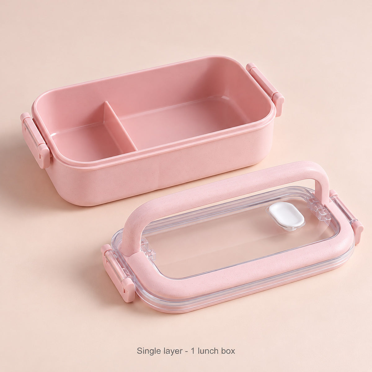 One pink single-layer lunchbox with its clear lid.