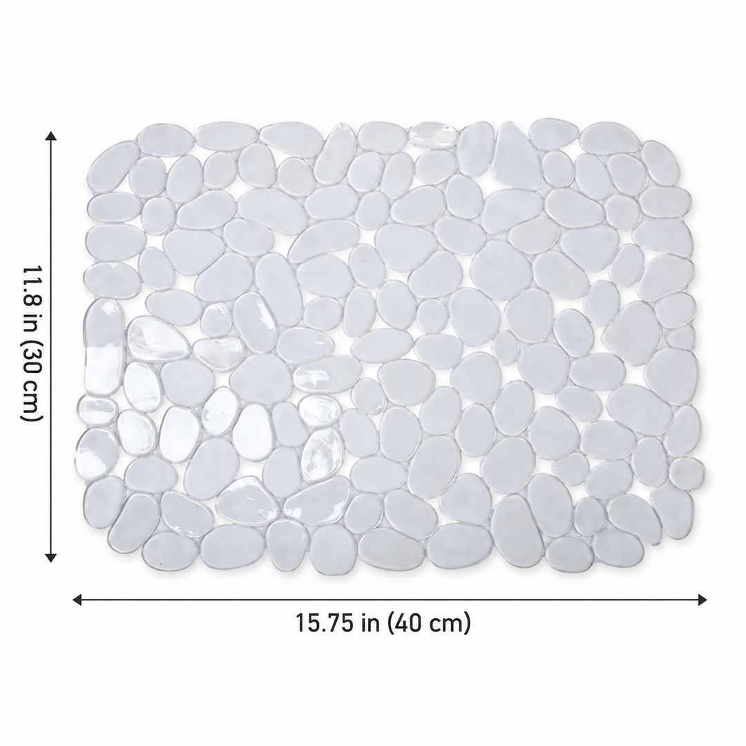 A rectangular pebble mosaic bath mat made of smooth, rounded glossy white stones, shown with dimension arrows and labels indicating 11.8 in (30 cm) by 15.