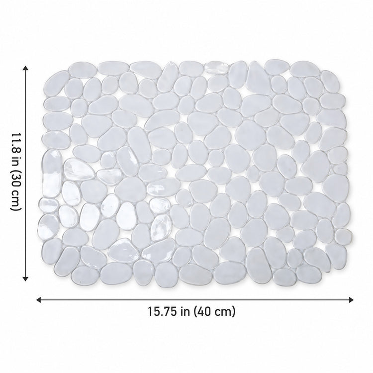 A rectangular pebble mosaic bath mat made of smooth, rounded glossy white stones, shown with dimension arrows and labels indicating 11.8 in (30 cm) by 15.