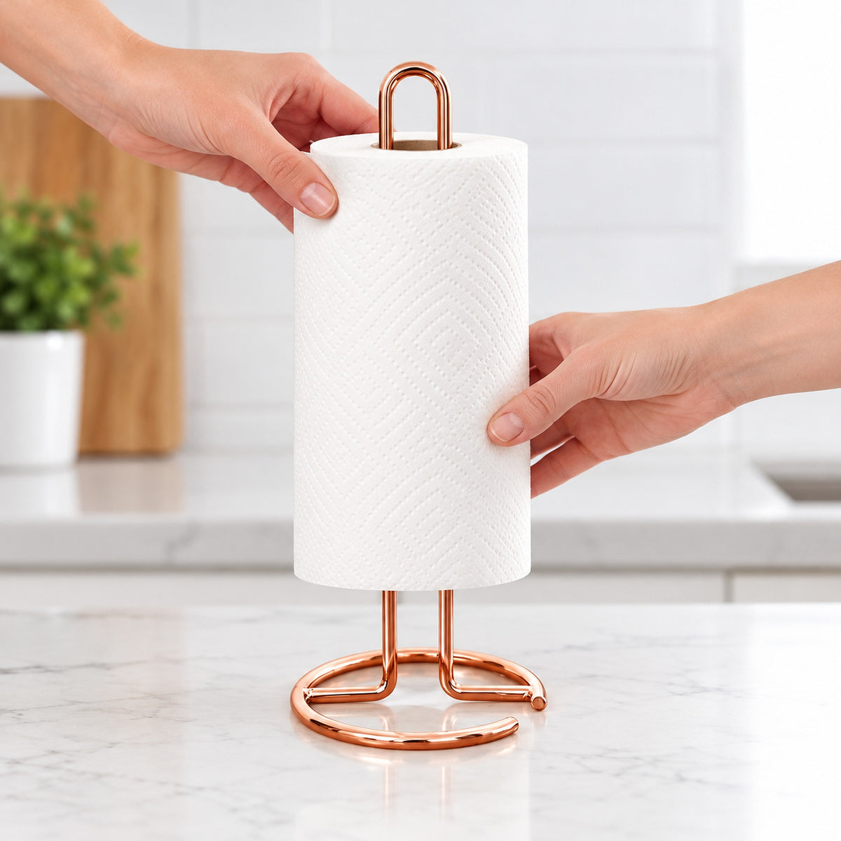 Loading a paper roll over the rose-gold upright loop.