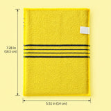 One yellow exfoliating mitt with approximate dimensions 5.51 x 7.28 inches (14 x 18.5 cm).