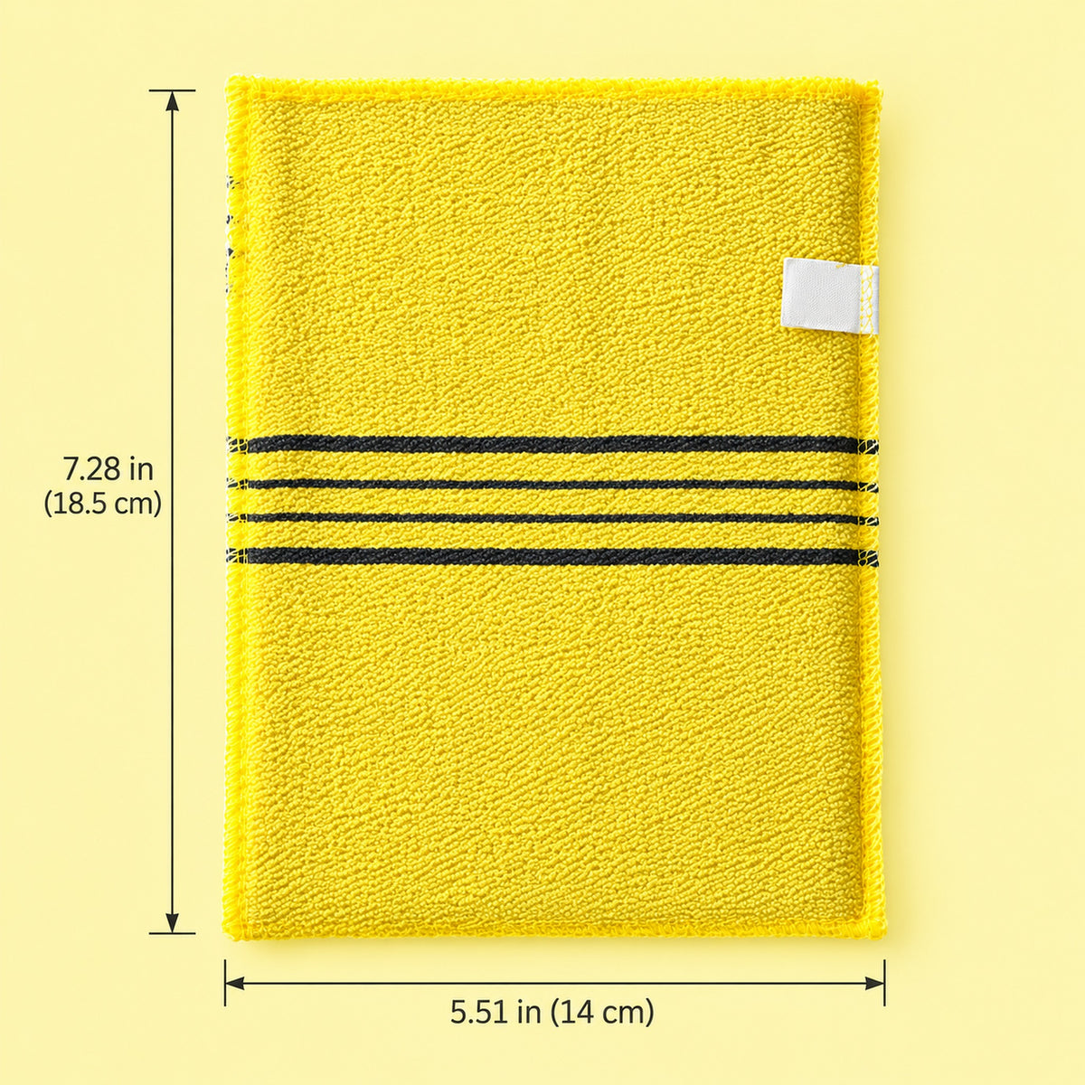 One yellow exfoliating mitt with approximate dimensions 5.51 x 7.28 inches (14 x 18.5 cm).