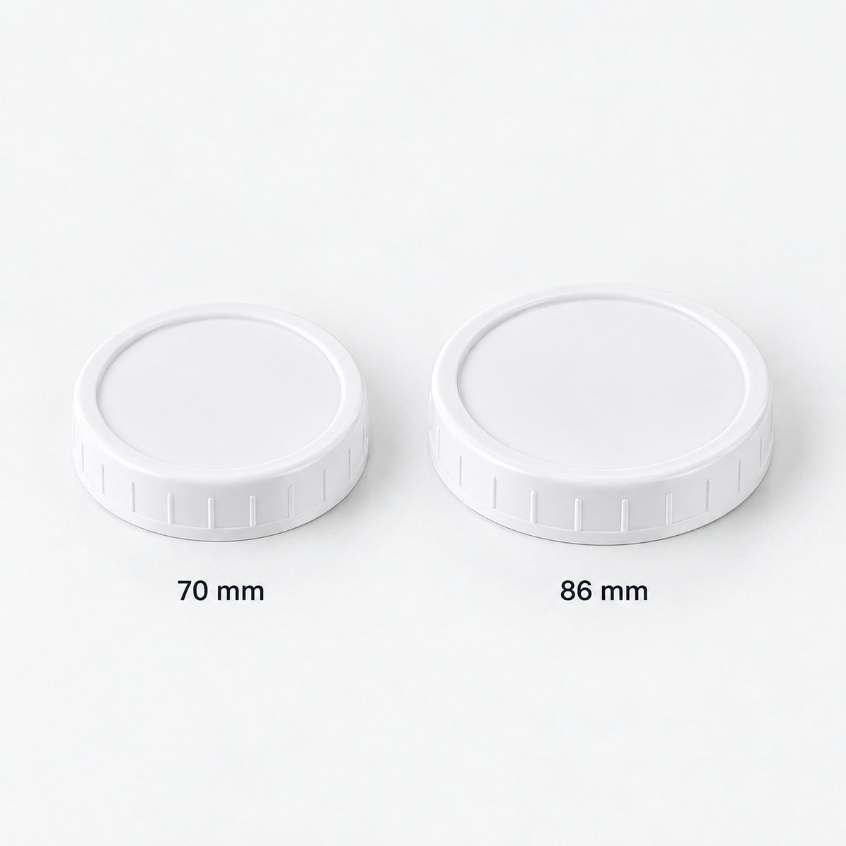 White lids in two alternative nominal sizes: 70 mm and 86 mm.