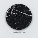 Black marble-print coaster with a 10 cm / 3.9 in diameter label.