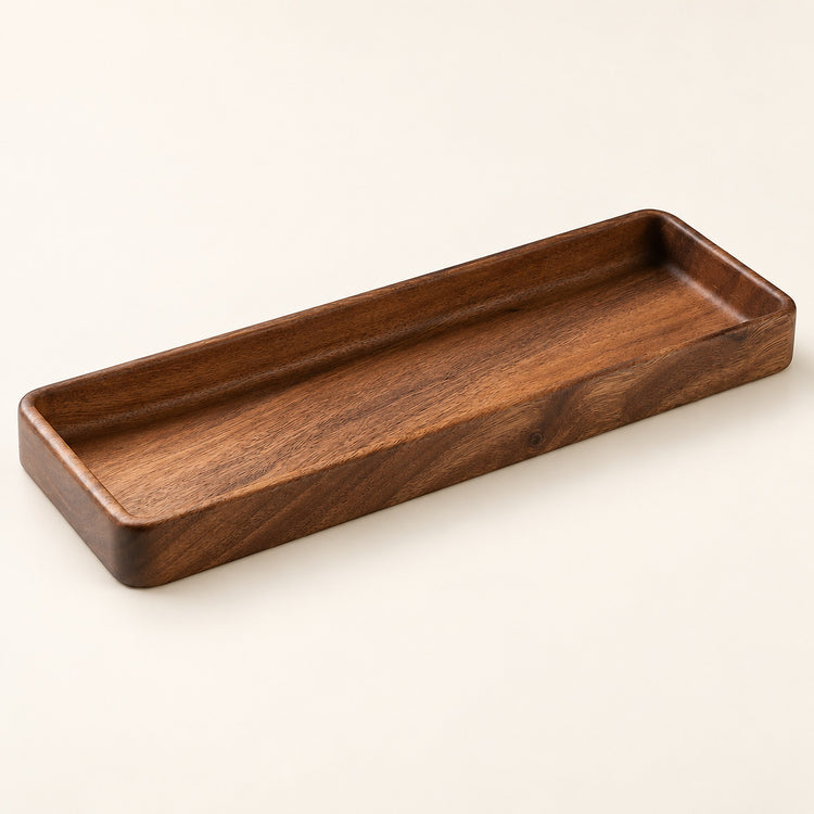 A rectangular wooden tray with rounded corners and a smooth, polished finish, shown on a plain off-white background.