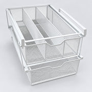 White metal mesh drawer organizer with two pull-out baskets and a top divider, shown on a light gray studio background.