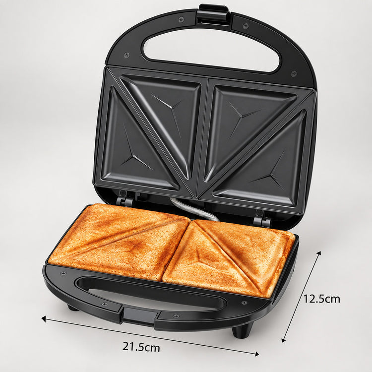 Black electric sandwich maker shown open with toasted bread inside, on a light gray background, with dimension labels indicating 21.5 cm width and 12.