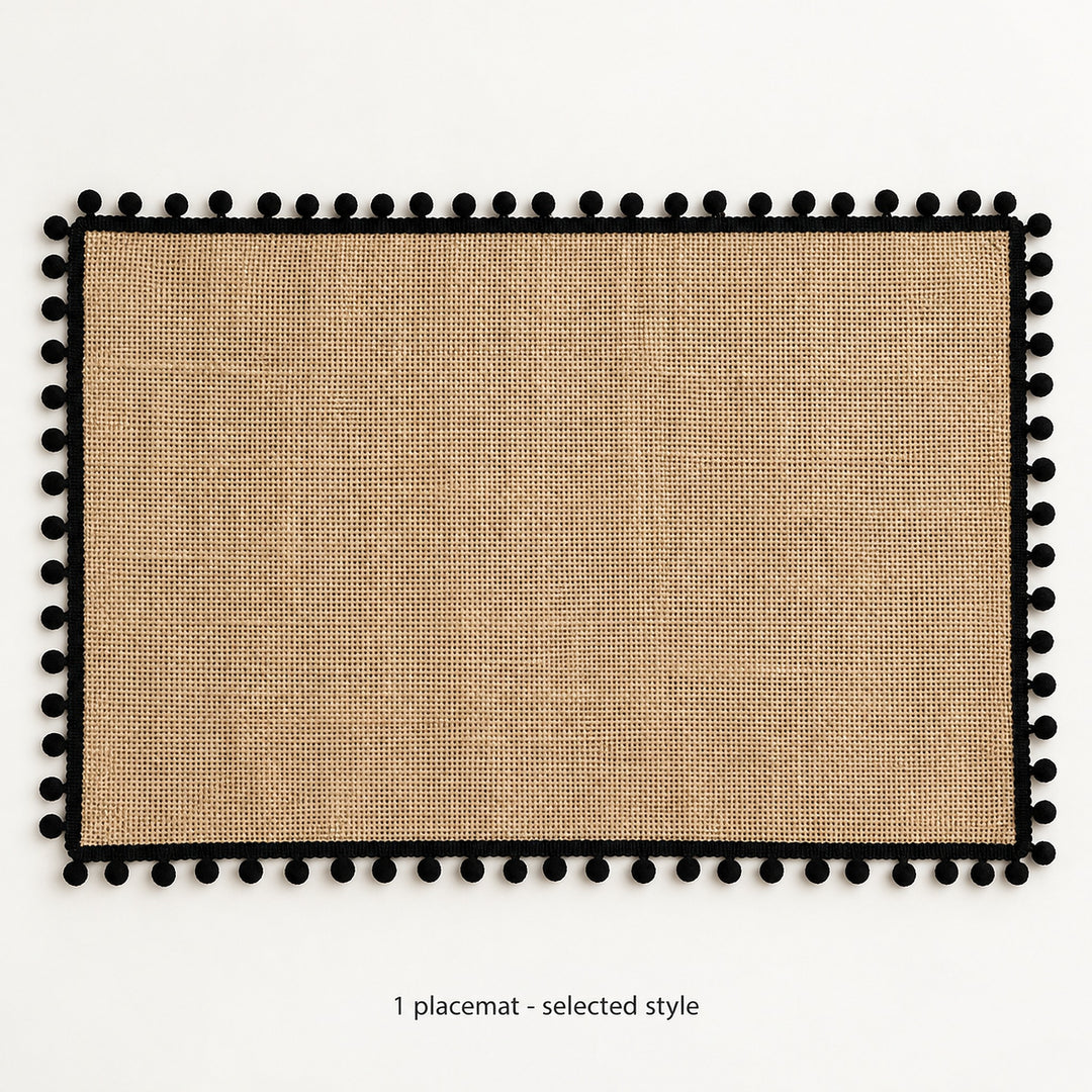 One black pom-pom trimmed placemat, selected style; 30 x 45 cm.